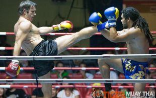 Andy Henry (red gloves) and Matthew Richardson (blue gloves) fights at Patong Sainamyen Road stadium in Phuket, Thailand, Thursday, Aug. 29, 2013. (Photo by Mitch Viquez Â©2013)