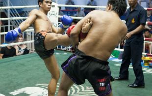 Tiger Muay Thai fighter Sake fights at Bangla stadium in Phuket, Thailand, Sunday, Jun. 9, 2013. (Photo by Mitch Viquez Â©2013)